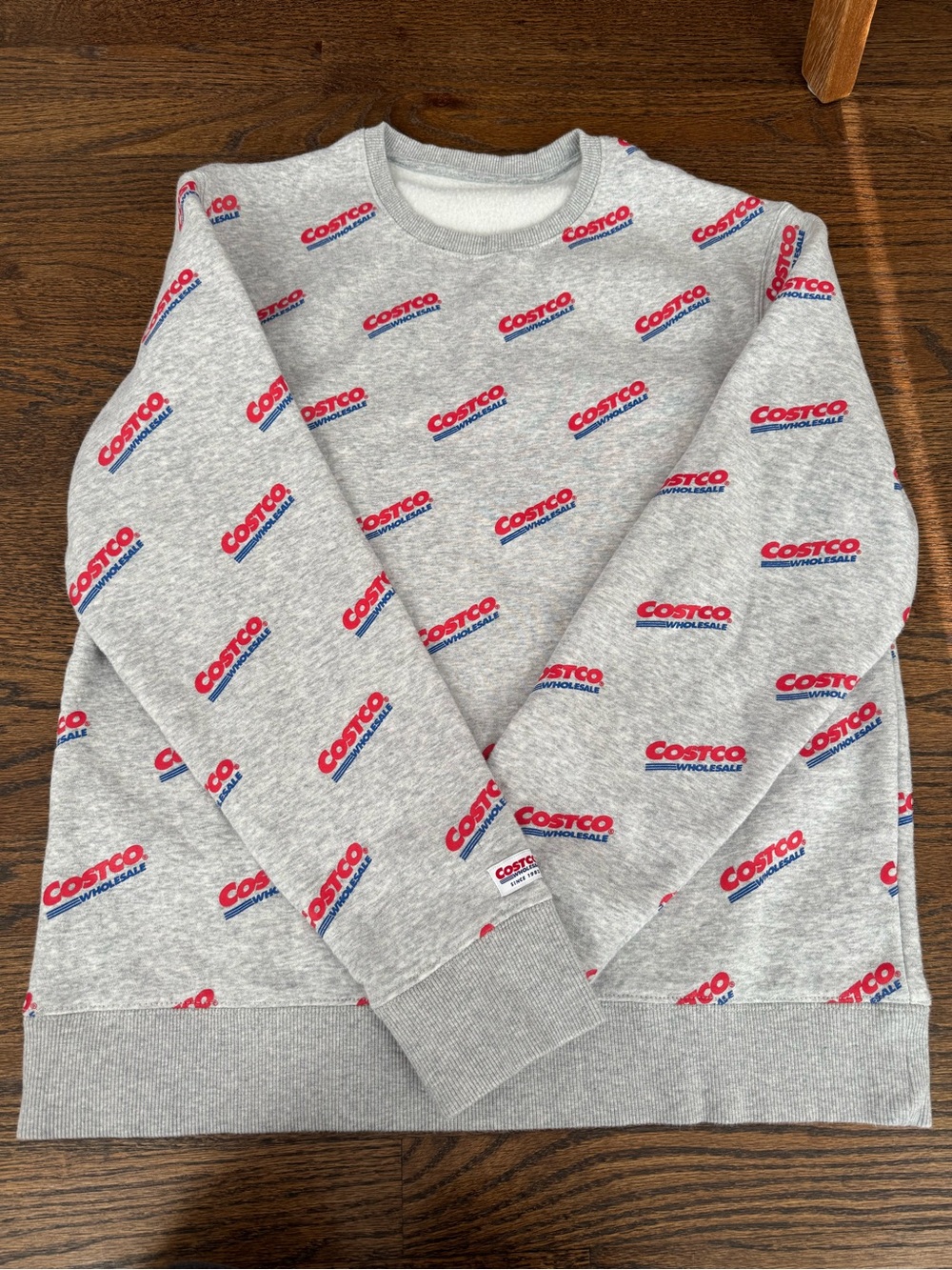 Kirkland Signature Costco Wholesale Gray Crewneck with Red and Blue Logo Print